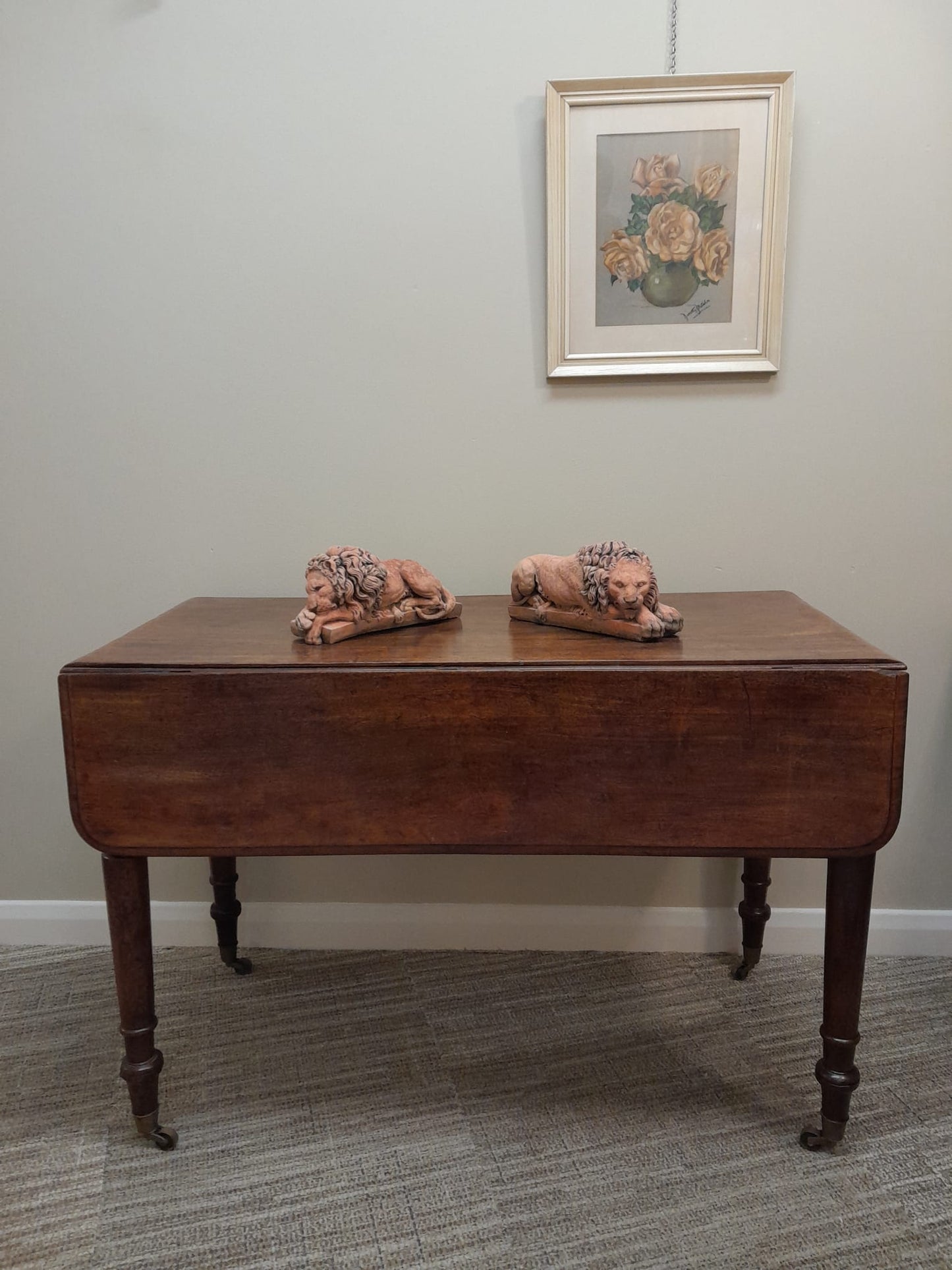 A pair of vintage recumbent terracotta lions