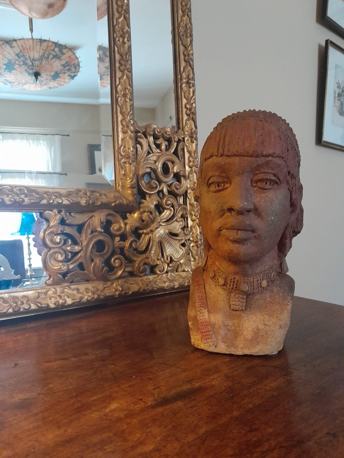 Red clay bust of an African woman