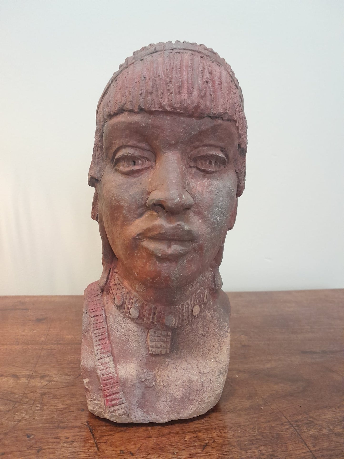 Red clay bust of an African woman