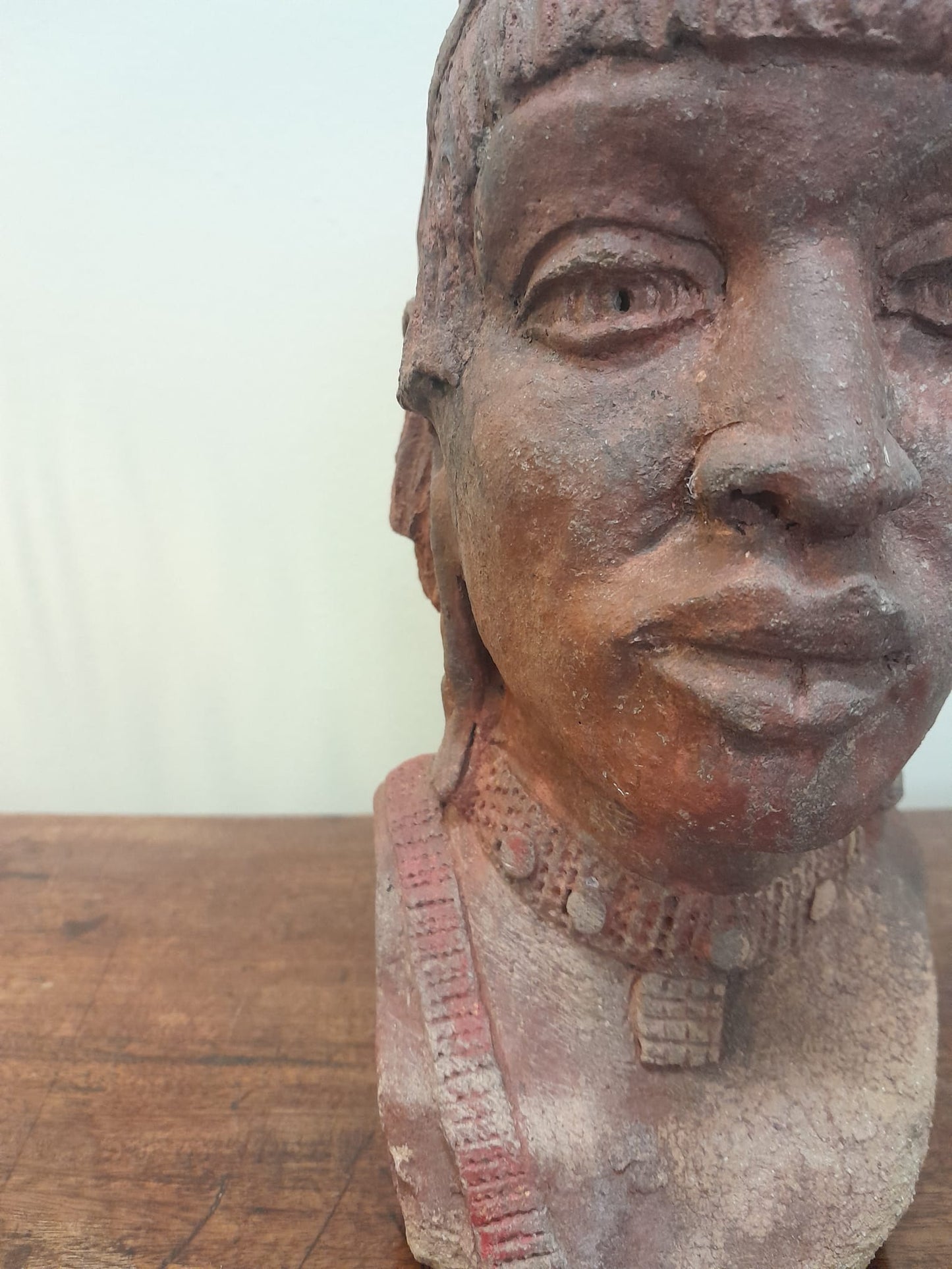 Red clay bust of an African woman