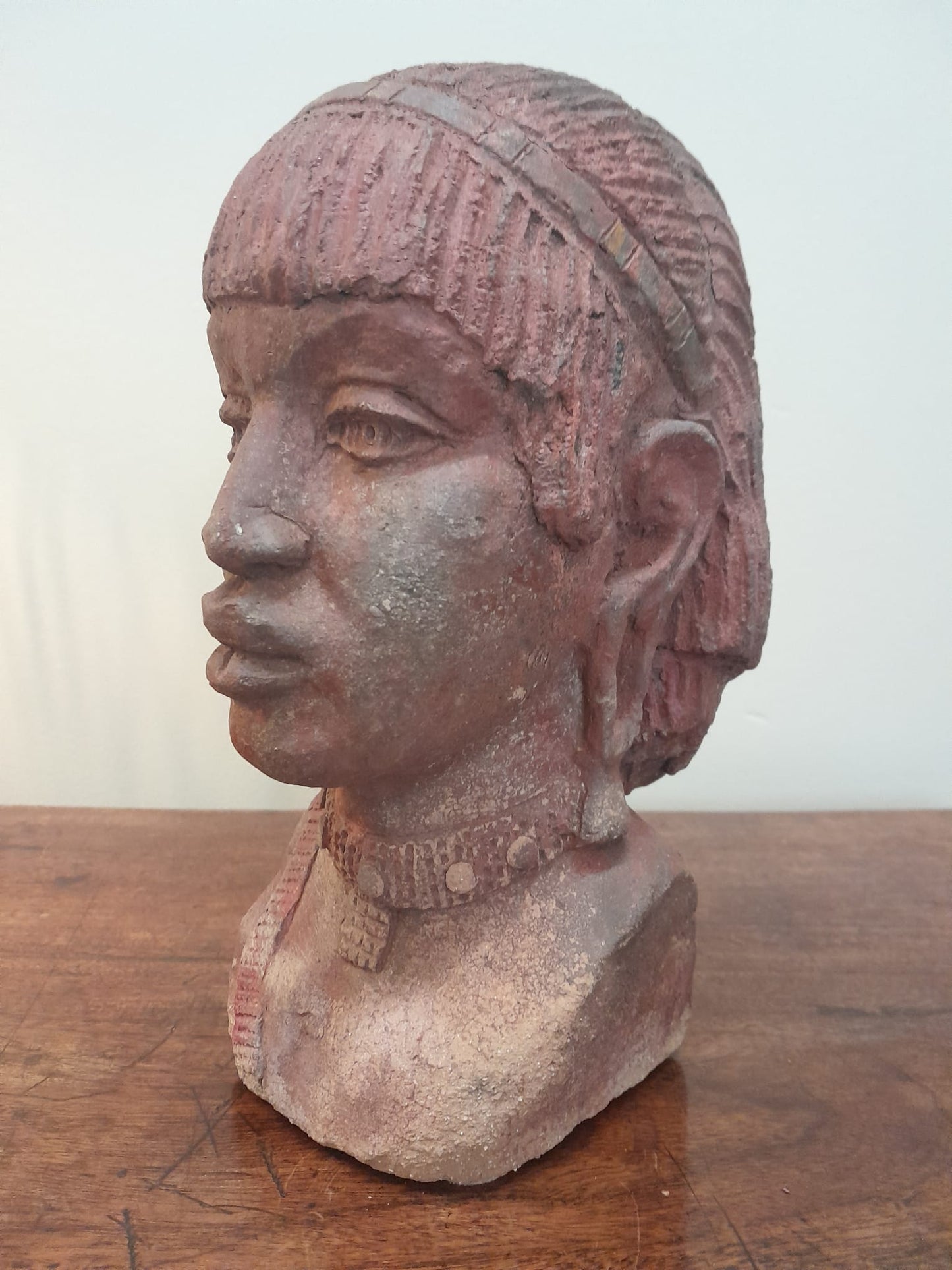 Red clay bust of an African woman