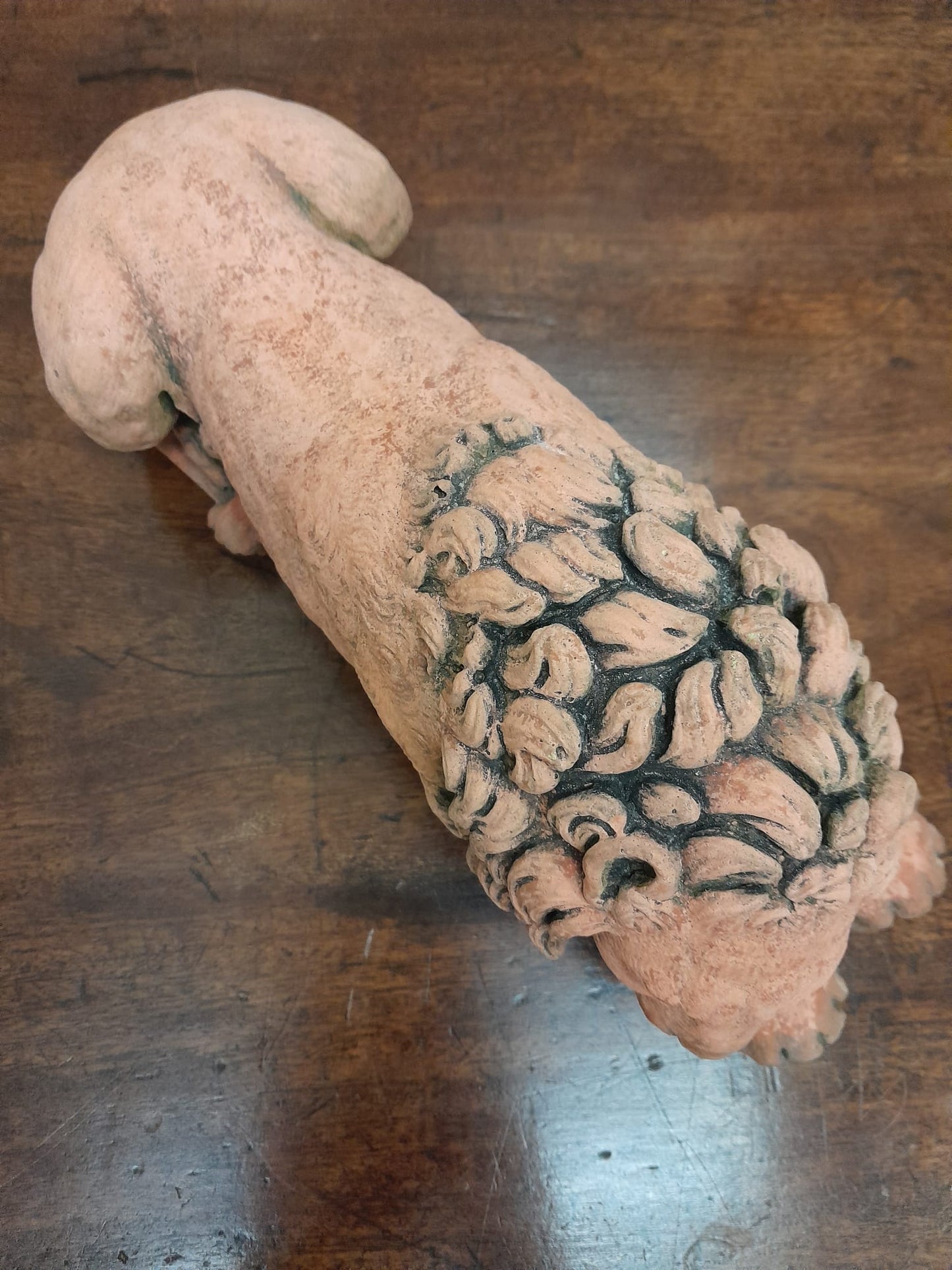 A pair of vintage recumbent terracotta lions